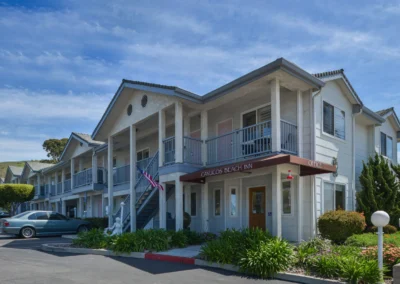 The inviting lobby of Cayucos Beach Inn with friendly staff ready to assist guests, offering a warm welcome to all who visit.